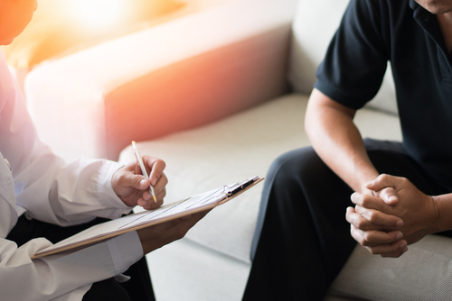 Physician Consults With Male Patient - Misconceptions About Men's Sexual Health