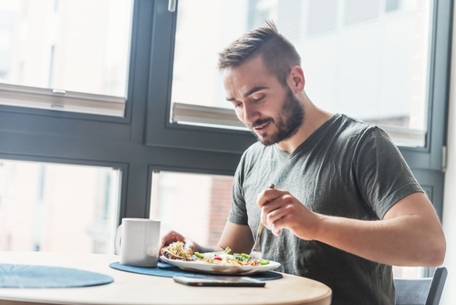 Man Eating A Healthy Breakfast - Healthy Testosterone levels 