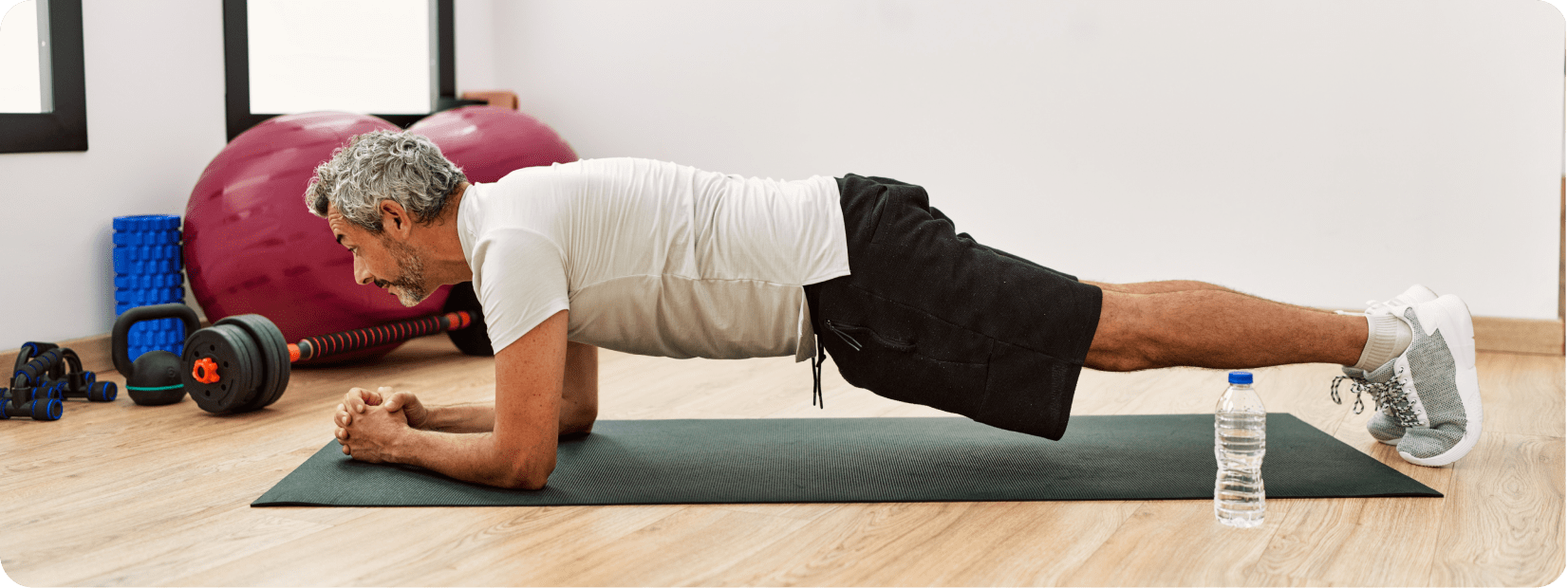 middle-aged man doing core exercises