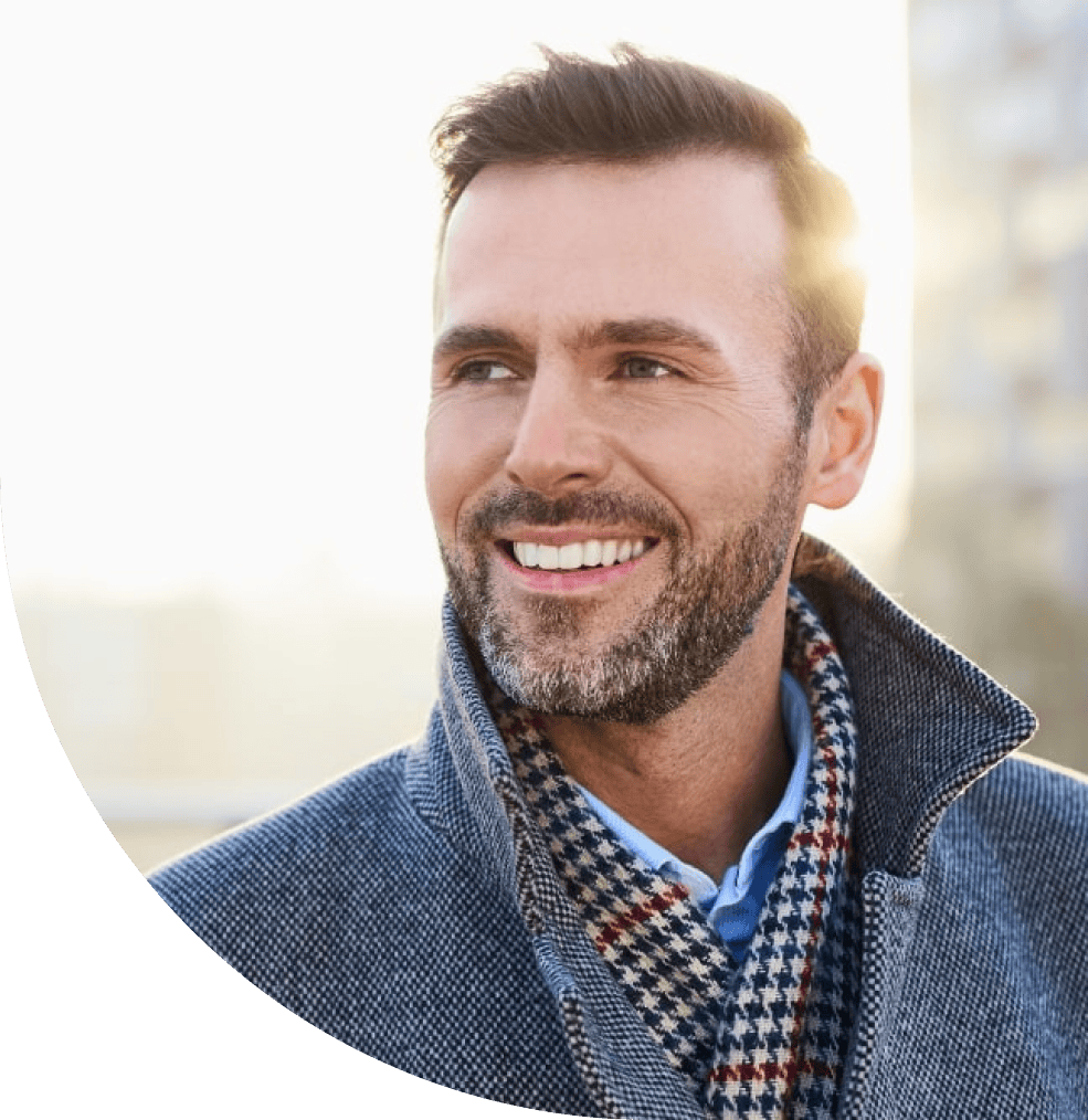Portrait of a healthy middle-aged man smiling outside