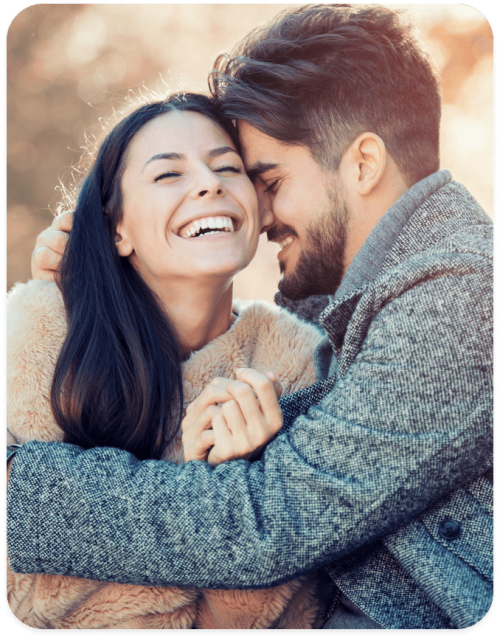 smiling couple hugging